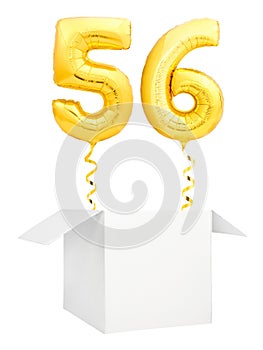 Golden number fifty six inflatable balloon with golden ribbon flying out of blank white box isolated on white background