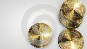 Golden nxt coins falling on white background