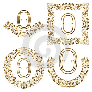 Golden O letter ornamental monograms set. Heraldic symbols in wreaths, square and round frames