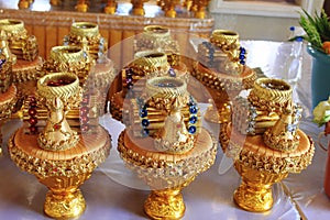 Golden offering pots inside the Buddhist temple at Ban Nong Chaeng, Phetchabun photo