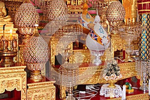 Golden offerings are placed on altars (Thailand) photo