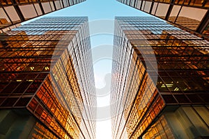 golden office building facade and blue sky, real estate business