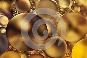 golden Oil bubbles macro colourful background