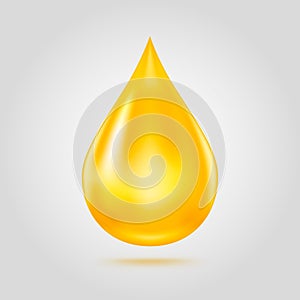 Golden oil drop isolated on light grey background.
