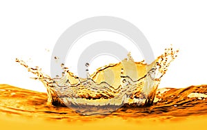 Golden oily liquid splash on white background