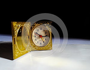 Golden old vintage clock like a box