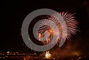 Golden orange amazing fireworks isolated in dark background close up with the place for text, , Malta