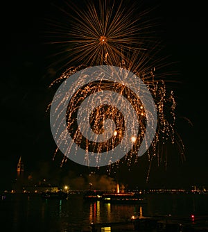 Golden orange amazing fireworks isolated in dark background close up with the place for text, Malta fireworks festival, 4 of July,