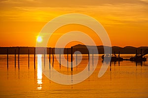 Golden orange sunset in Anacortes, WA Ship harbor photo