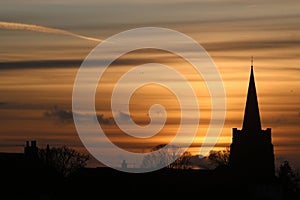 Golden orange sunset over roof-tops of Pilling