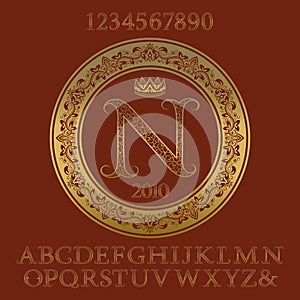 Golden ornate letters and numbers with initial monogram.