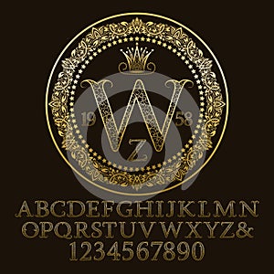 Golden ornate letters and numbers with W initial monogram.