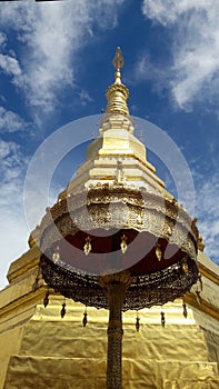 Golden Pagoda and golden ambrella in Thailand WatPradhatchohar