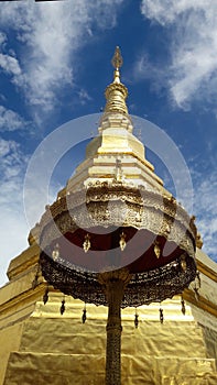 Golden Pagoda and golden ambrella in Thailand WatPradhatchohar photo