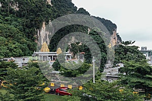 Golden pagoda with green mountain near Batu Caves near Kuala Lumpur, Malaysia.
