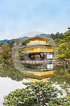 Golden pagoda on lake in autumn at Kinkakuji Temple, Kyoto, Japan.