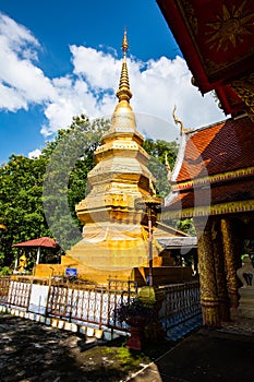 Golden pagoda in Phrathat Chom Sin temple