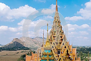 Golden pagoda statue with mountain, Wat Tham Sua(Tiger Cave Temple)