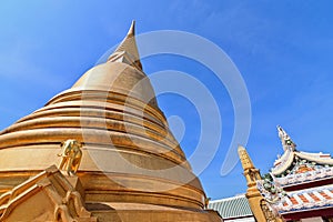 Golden Pagoda of Wat Bowonniwet Vihara on Sunny Day