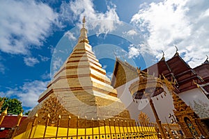 Golden pagoda at Wat Phra That Cho Hae Temple in Phrae province, Thailand