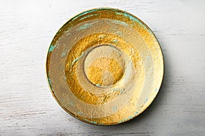 Golden painted decorative plate