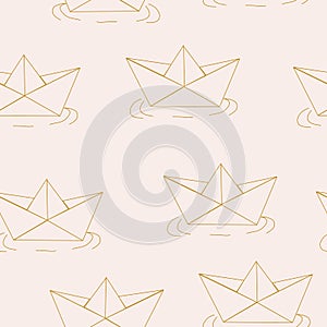 Golden paper boats in a seamless pattern design