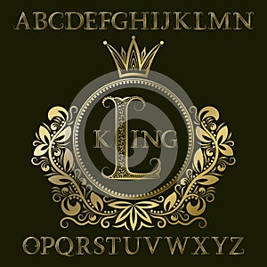 Golden patterned letters and initial monogram in coat of arms form with crown. Royal font and elements kit for logo design