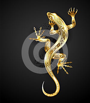 Golden patterned lizard on black background