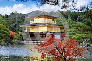 Golden Pavilion at Kinkakuji Temple with red leaves in Autumn se
