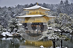 Golden pavilion in kyoto under the snow photo