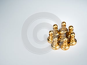 The golden pawn chess pieces standing together on white background.
