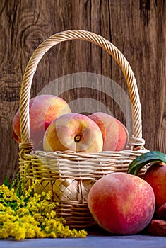Golden peaches in a wicker basket