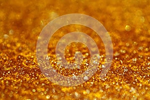 Golden pearly glitter sparkles background photo