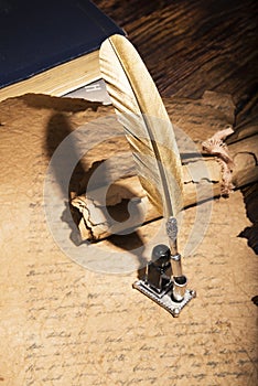 Golden pen and ancient manuscripts