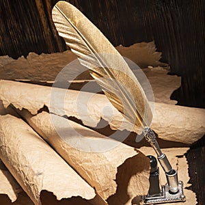 Golden pen and ancient manuscripts