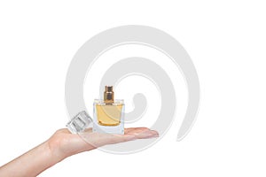 Golden perfume bottle with hand isolated on white background, copy space template