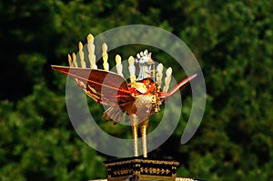 Golden phoenix on portable shrine at Jidai Matsuri parade, Japan.