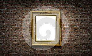 Golden picture frame on dark brick wall