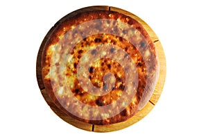 Golden Pie on Wooden Board isolated on a white background