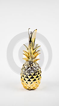 golden pineapple on a white background. copy space