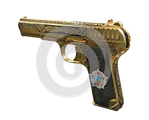 Golden pistol TT with a copy of the Order of Victory, released in 1945. Isolated on white