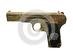 Golden pistol TT with a copy of the Order of Victory, released in 1945. Isolated on white