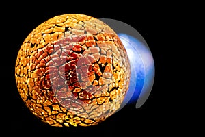 Golden planet with white blue star in deep black space