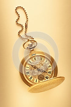 Golden pocket watch with chain