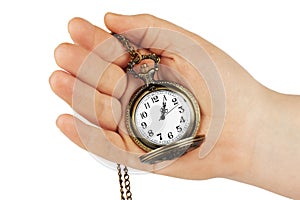 Golden pocket watch in hand