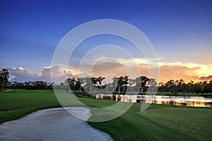 Golden pond at sunset at a golf course on a tropical island