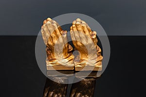Golden praying hands salt and pepper shakers