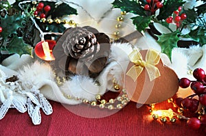 Golden Present Box with Christmas Decoration on Background