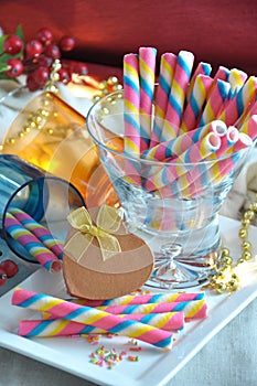 Golden Present Box with Colorful Wafer on Background