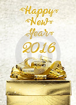 Golden Present box with Happy New Year 2016 word at bokeh light